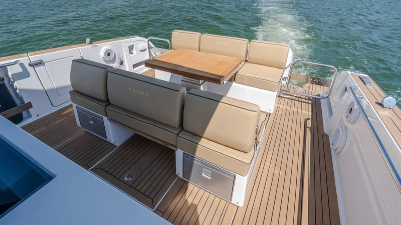  Yacht Photos Pics 2023 Pardo Yachts P38 deck with seating and table on open water.
