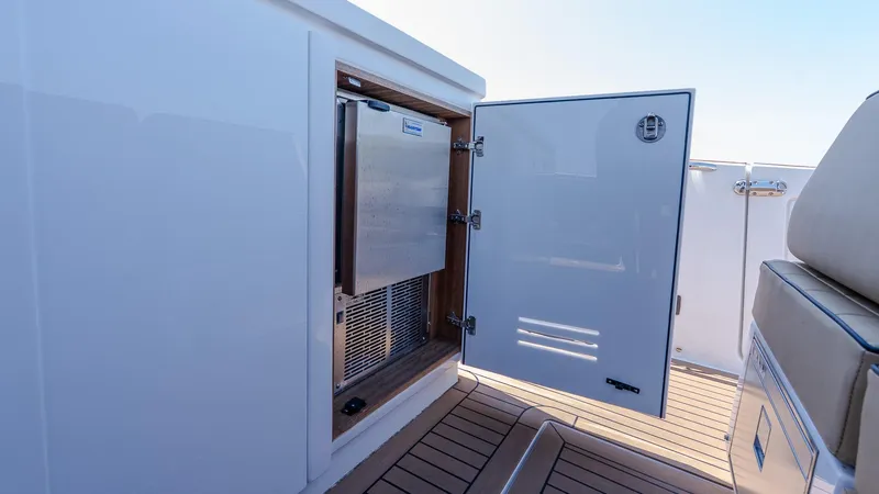  Yacht Photos Pics Open storage compartment on 2023 Pardo Yachts P38, featuring sleek design and wood accents.