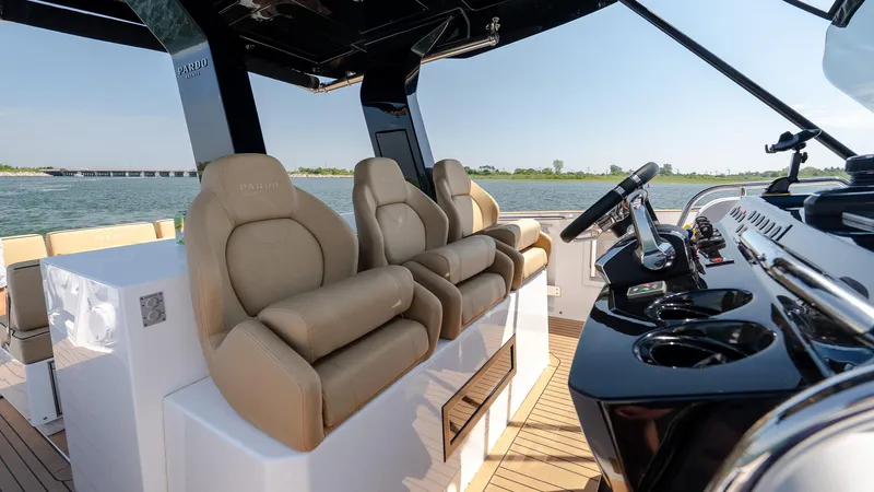  Yacht Photos Pics Luxurious 2023 Pardo Yachts P38 interior with plush seating and sleek control panel.