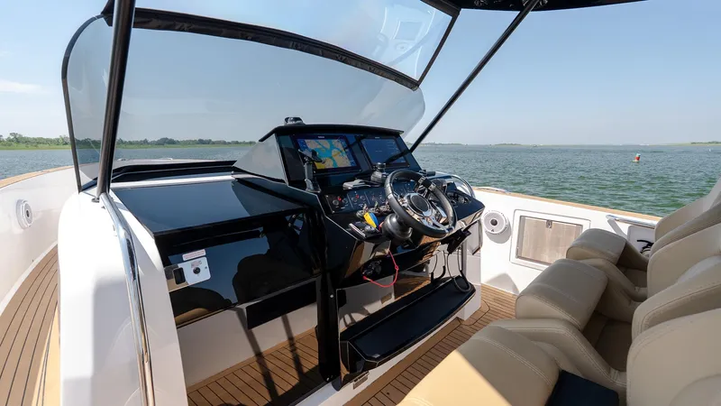  Yacht Photos Pics 2023 Pardo Yachts P38 helm with modern navigation system on open water.
