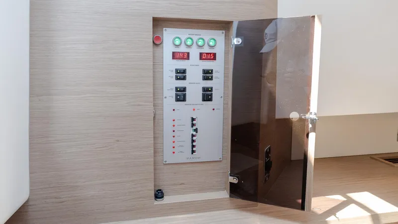  Yacht Photos Pics Electrical control panel inside 2023 Pardo Yachts P38, featuring switches and digital displays.
