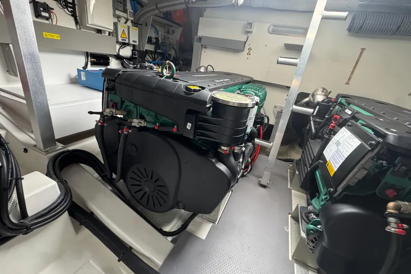 Serenity Yacht Photos Pics Engine room of 2023 Prestige 460S yacht, showcasing dual engines and mechanical components.