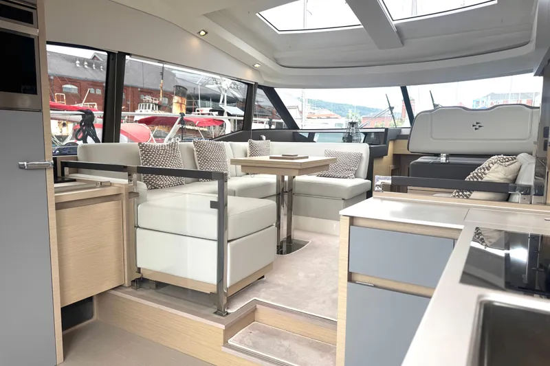Serenity Yacht Photos Pics Luxurious interior of 2023 Prestige 460S yacht with modern seating and elegant design.