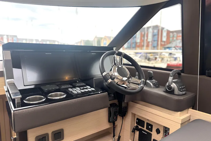 Serenity Yacht Photos Pics Cockpit of 2023 Prestige 460S yacht with modern controls and navigation screens.