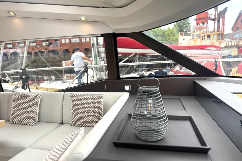 Serenity Yacht Photos Pics Luxurious interior of 2023 Prestige 460S yacht with elegant seating and decor.