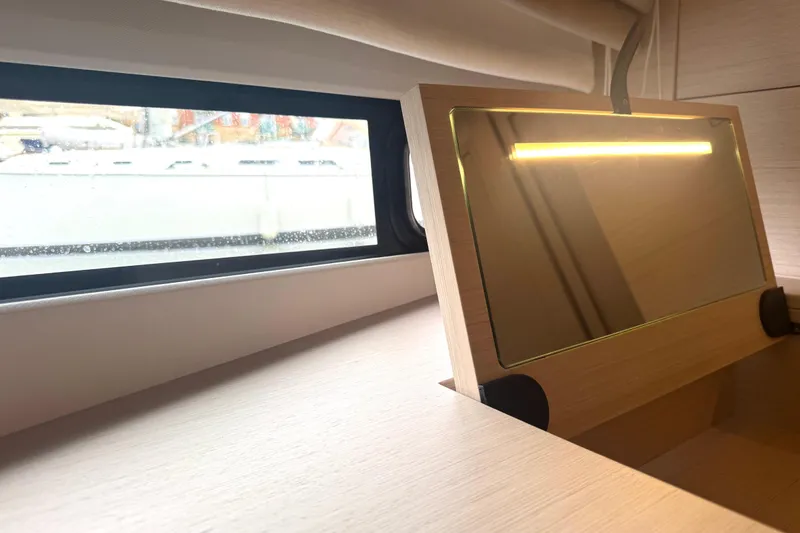 Serenity Yacht Photos Pics Interior of 2023 Prestige 460S yacht with window and illuminated mirror.