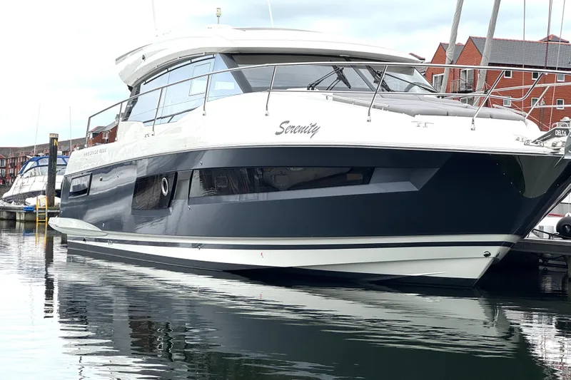 Serenity Yacht Photos Pics 2023 Prestige 460S yacht "Serenity" docked in a marina, reflecting on calm water.