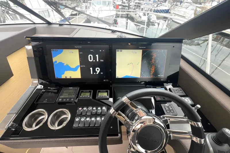 Serenity Yacht Photos Pics Cockpit of 2023 Prestige 460S yacht with advanced navigation displays and controls.
