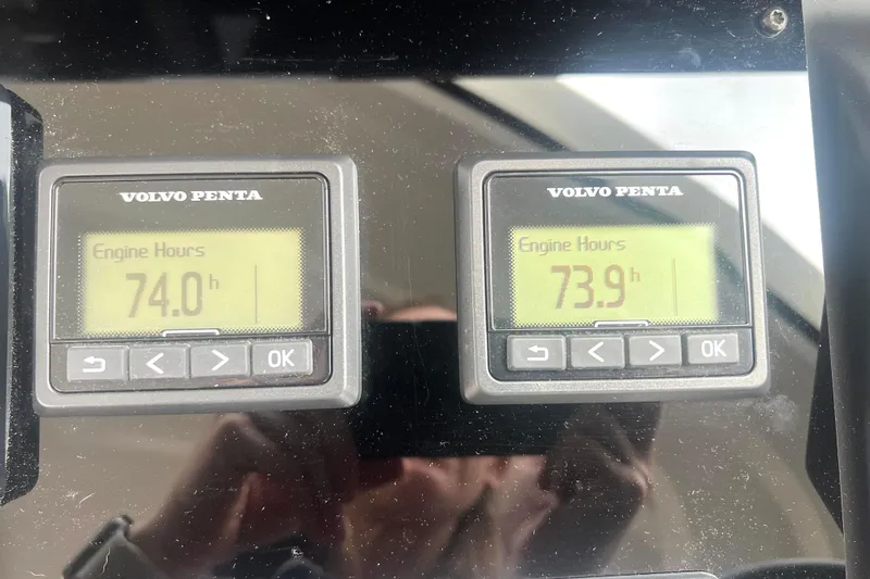Serenity Yacht Photos Pics Volvo Penta engine hour meters showing 74.0 and 73.9 hours on Prestige 460S, 2023.