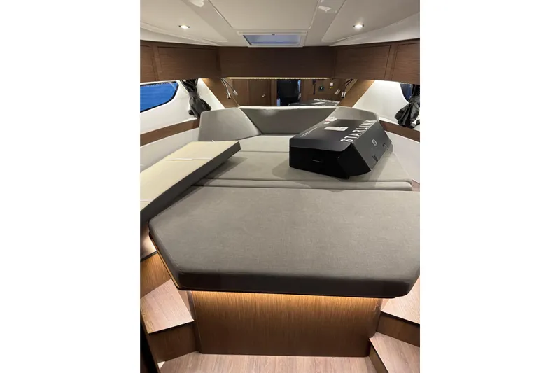  Yacht Photos Pics Interior cabin of 2025 Beneteau Antares 11 Fly, featuring modern design and comfortable seating.