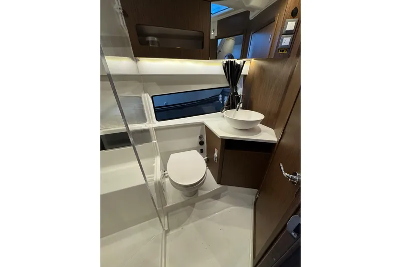  Yacht Photos Pics Modern bathroom interior of 2025 Beneteau Antares 11 Fly yacht, featuring sleek design elements.