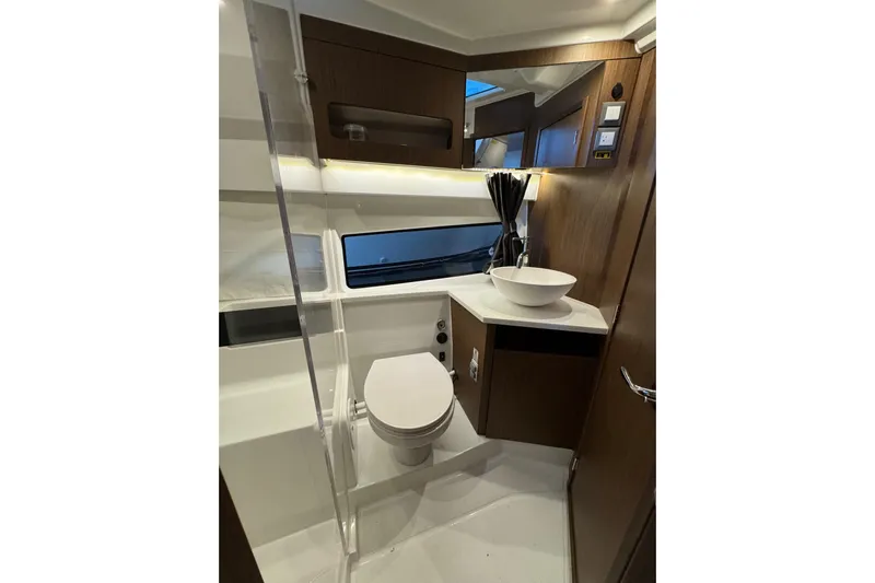  Yacht Photos Pics Luxurious bathroom in 2025 Beneteau Antares 11 Fly yacht with modern fixtures.