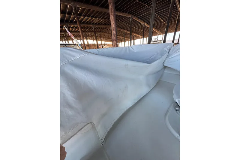  Yacht Photos Pics 2025 Beneteau Antares 11 Fly under cover in a wooden boathouse.