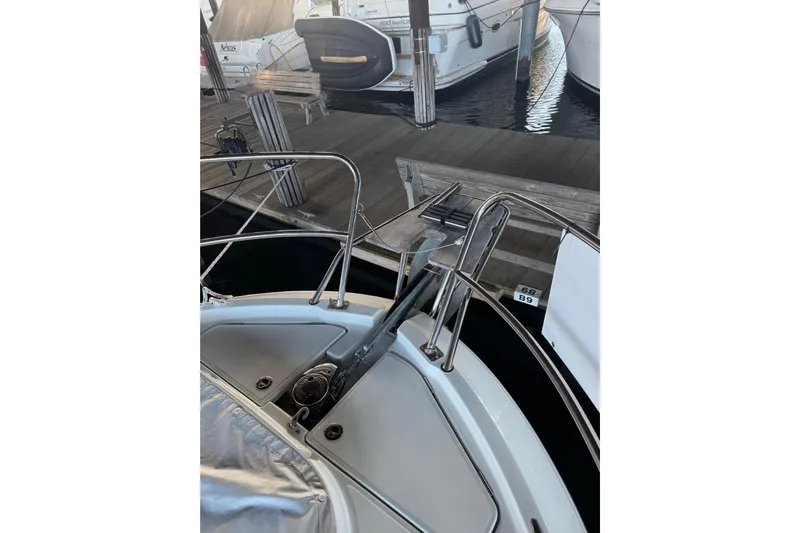  Yacht Photos Pics 2025 Beneteau Antares 11 Fly yacht docked, showcasing bow and anchor details.