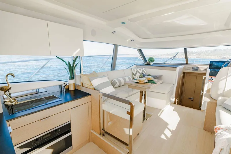  Yacht Photos Pics Manufacturer Provided Image: Luxurious interior of 2023 Prestige 420 S yacht with modern kitchen and seating area.