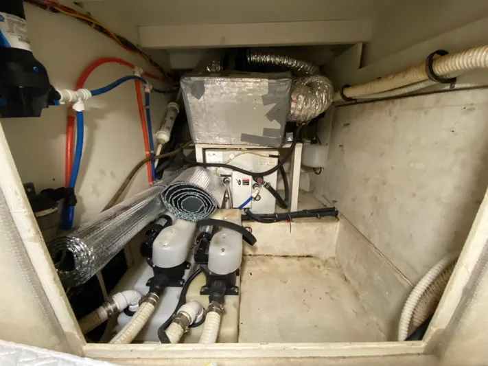  Yacht Photos Pics Engine room of 2001 Bayliner 3988 with visible pipes and equipment.