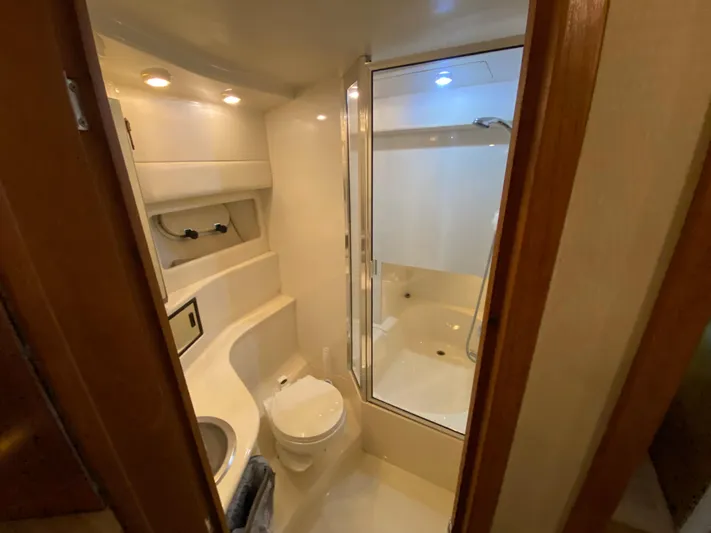  Yacht Photos Pics Bathroom interior of 2001 Bayliner 3988 yacht, featuring shower and toilet.