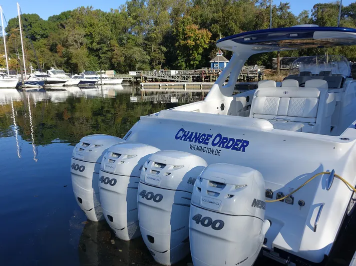  Yacht Photos Pics 2014 Cigarette 42 Huntress boat with four powerful engines docked at a marina.