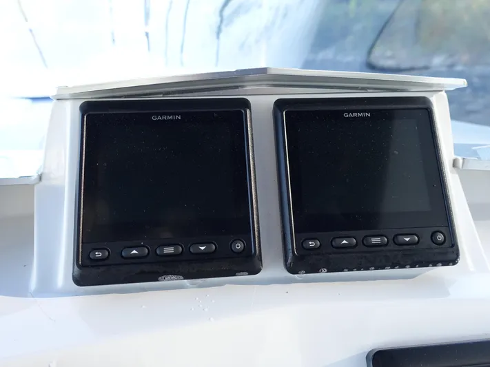  Yacht Photos Pics Garmin navigation displays on 2014 Cigarette 42 Huntress boat dashboard.