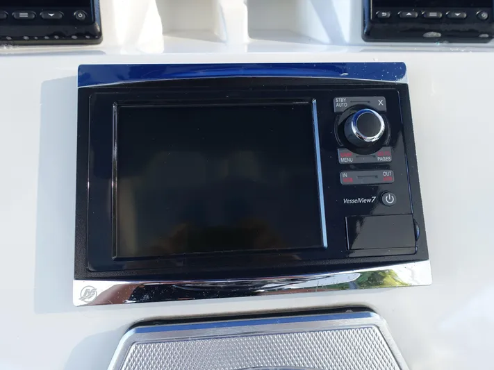  Yacht Photos Pics Control panel of a 2014 Cigarette 42 Huntress boat with display screen and buttons.
