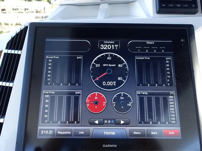  Yacht Photos Pics Garmin display on 2014 Cigarette 42 Huntress showing speed, odometer, and engine metrics.