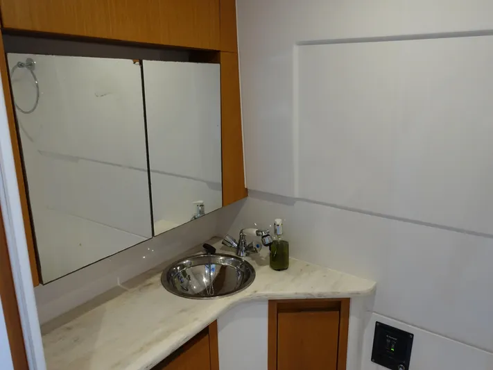  Yacht Photos Pics 2014 Cigarette 42 Huntress bathroom with modern sink and mirror.