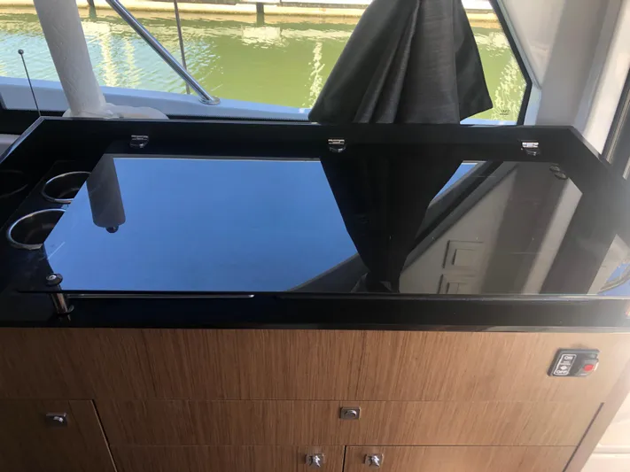  Yacht Photos Pics Modern kitchen area on 2022 Beneteau Antares 9 yacht with sleek countertop design.