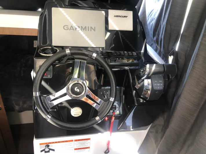  Yacht Photos Pics Helm of 2022 Beneteau Antares 9 with Garmin and Mercury controls.