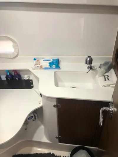  Yacht Photos Pics Bathroom interior of 2022 Beneteau Antares 9 with sink and toiletries.