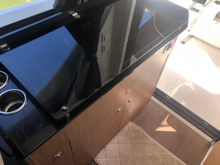  Yacht Photos Pics Interior of 2022 Beneteau Antares 9, featuring sleek cabinetry and modern design.
