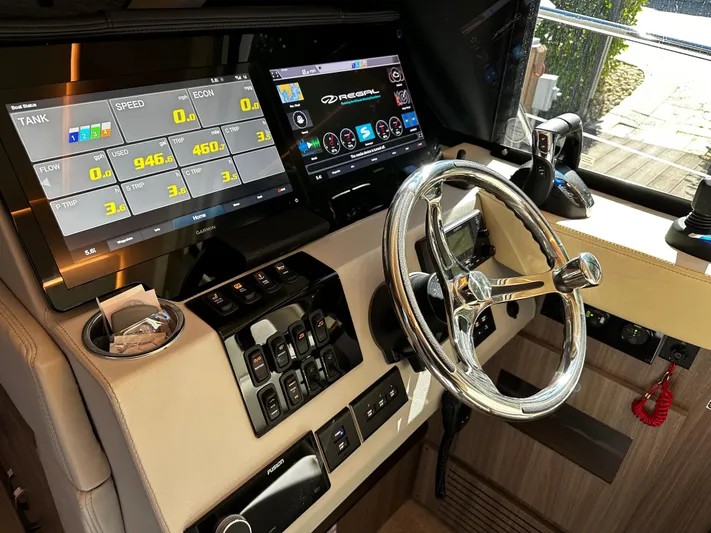 Fully Vested Yacht Photos Pics 2022 Regal 42 FXO helm with modern controls and dual display screens.