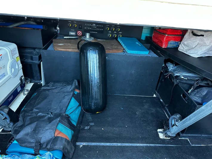 Fully Vested Yacht Photos Pics Storage compartment of a 2022 Regal 42 FXO boat with various equipment.
