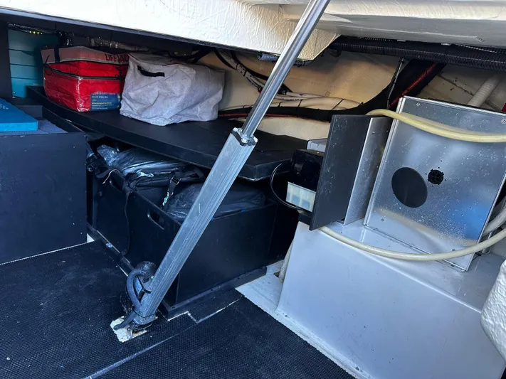 Fully Vested Yacht Photos Pics Storage compartment in 2022 Regal 42 FXO boat, featuring organized equipment and supplies.