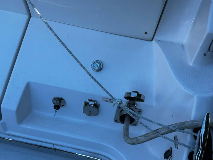 Fully Vested Yacht Photos Pics Close-up of 2022 Regal 42 FXO boat deck with rope and fittings.