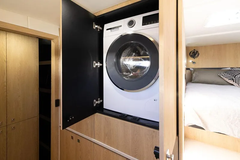  Yacht Photos Pics Modern laundry area in Introductory Cure Marine 55 yacht, 2025 model.