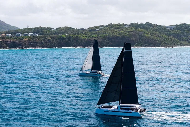  Yacht Photos Pics Two Cure Marine 55 sailboats on blue ocean near lush coastline, 2025 model.