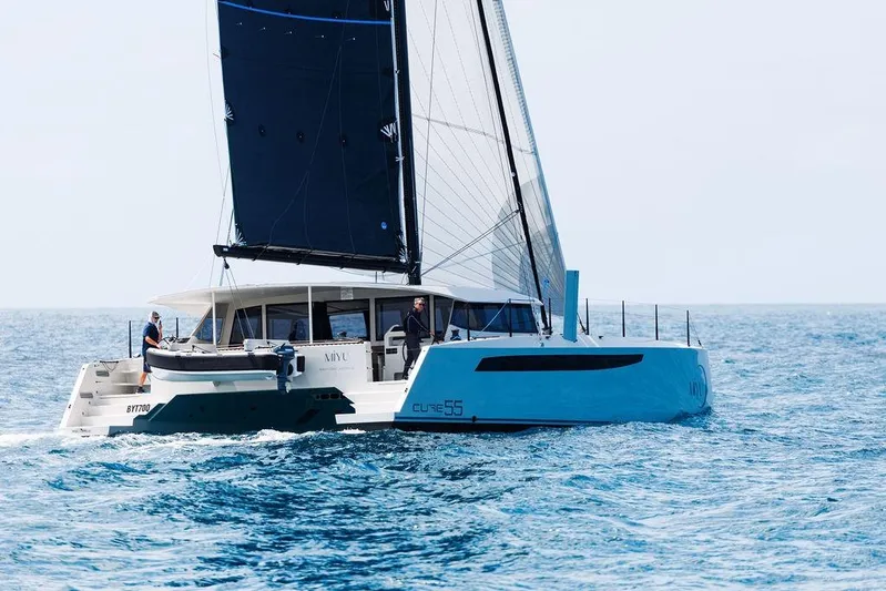  Yacht Photos Pics Sailing catamaran Cure Marine 55, 2025 model, cruising on open sea.