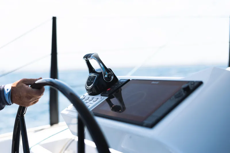  Yacht Photos Pics Steering console of Introductory Cure Marine 55 yacht, 2025 model, on open sea.