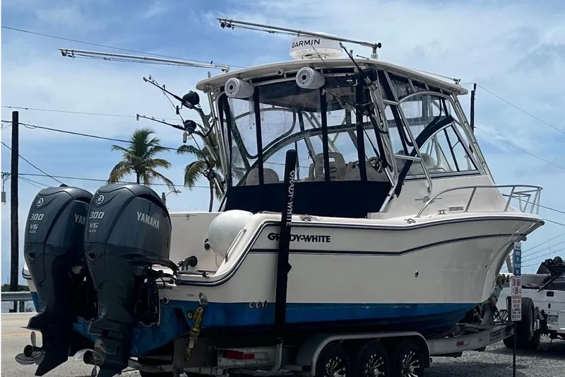  Yacht Photos Pics 2007 Grady-White Express 305 boat with twin Yamaha engines on a trailer.