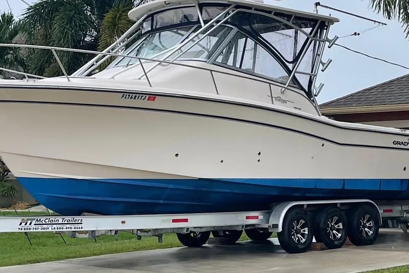  Yacht Photos Pics 2007 Grady-White Express 305 boat on trailer, parked in driveway.