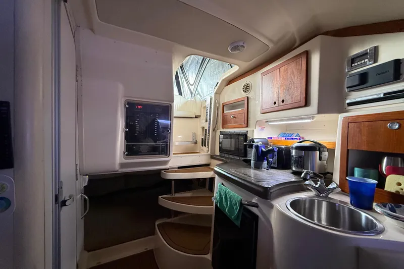  Yacht Photos Pics Interior of 2007 Grady-White Express 305 boat with kitchenette and storage cabinets.