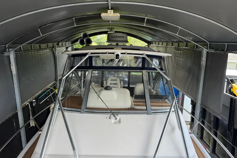  Yacht Photos Pics 2007 Grady-White Express 305 boat under a covered storage with Garmin equipment.