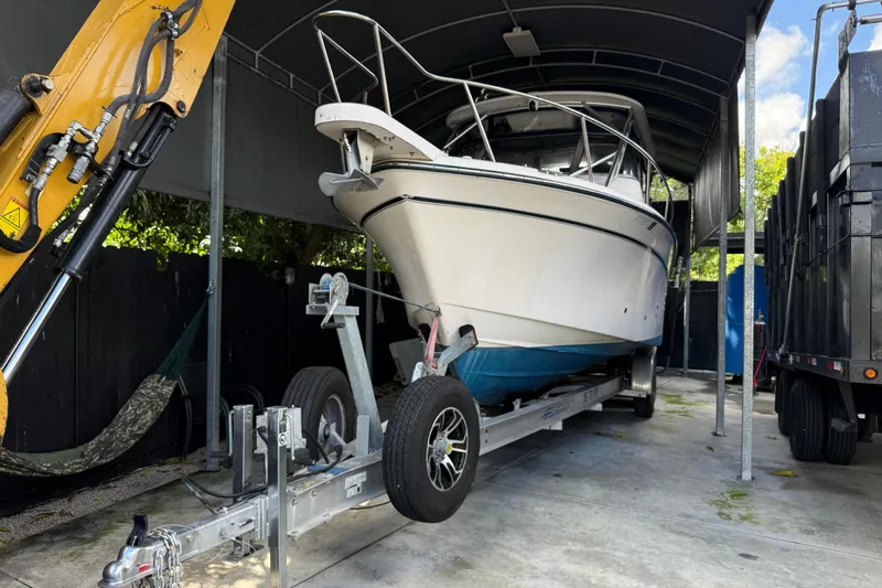 Yacht Photos Pics 2007 Grady-White Express 305 boat on trailer under shelter, side view.
