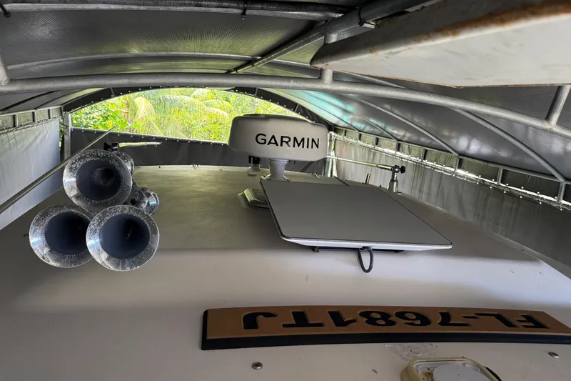  Yacht Photos Pics 2007 Grady-White Express 305 boat with Garmin radar and triple horns under a canopy.