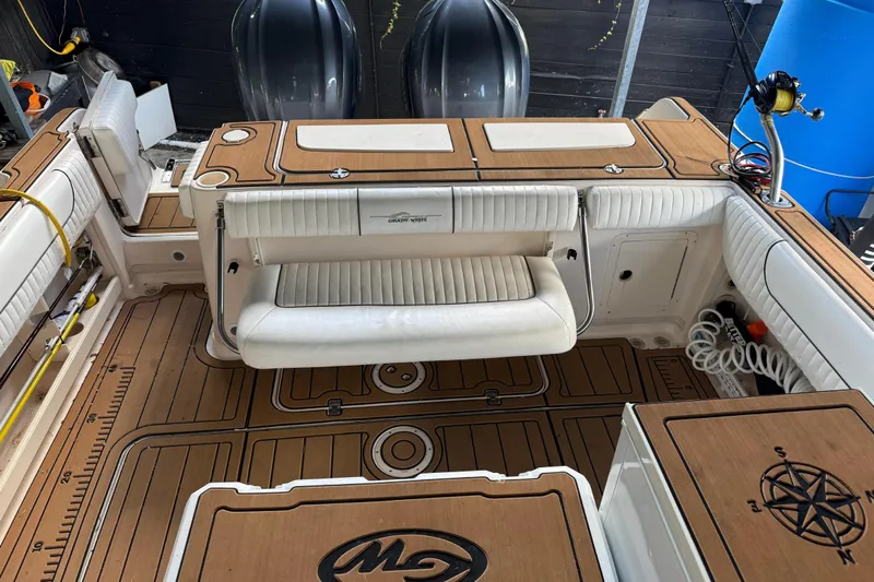  Yacht Photos Pics 2007 Grady-White Express 305 boat interior with teak flooring and cushioned seating.