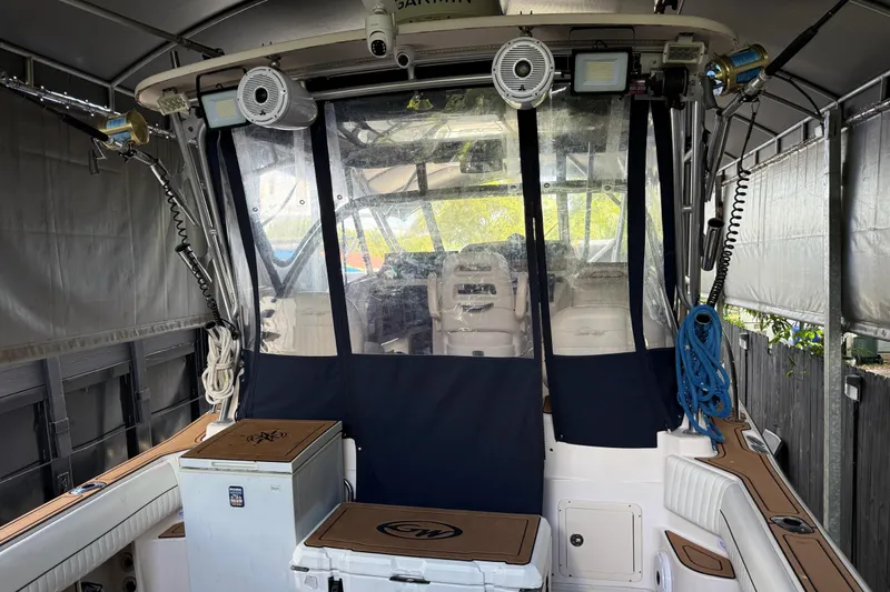  Yacht Photos Pics 2007 Grady-White Express 305 boat interior with fishing equipment and seating area.