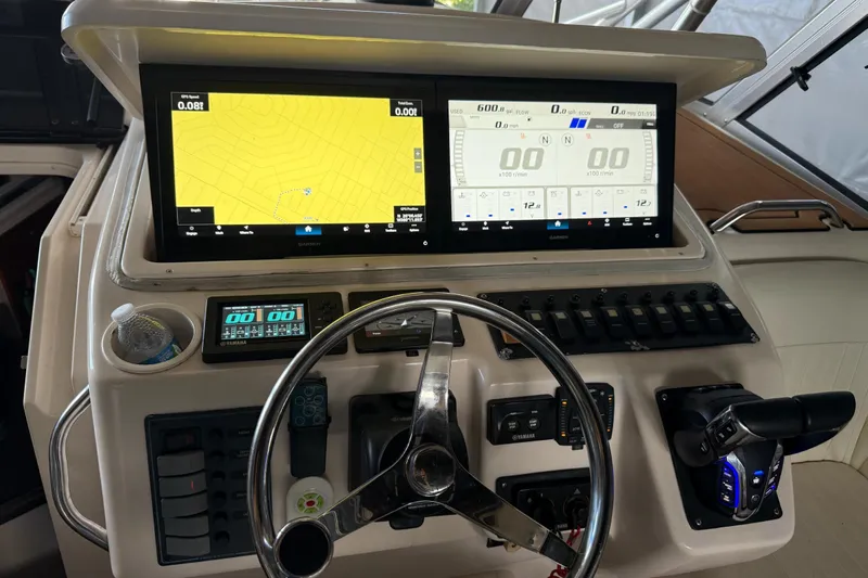  Yacht Photos Pics 2007 Grady-White Express 305 boat dashboard with navigation screens and controls.