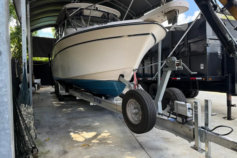  Yacht Photos Pics 2007 Grady-White Express 305 boat on trailer in covered storage area.