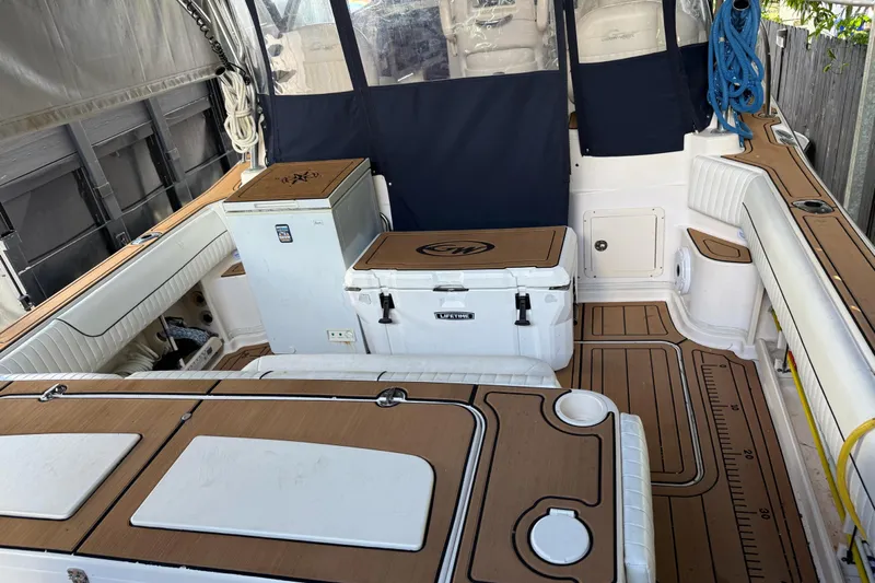  Yacht Photos Pics 2007 Grady-White Express 305 boat interior with seating, storage, and fishing equipment.