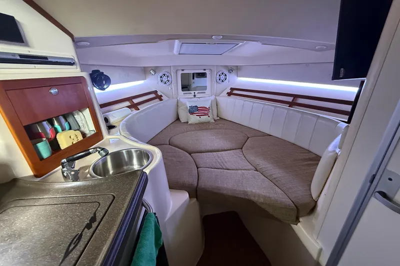  Yacht Photos Pics Interior of 2007 Grady-White Express 305 boat with cozy seating and kitchenette.